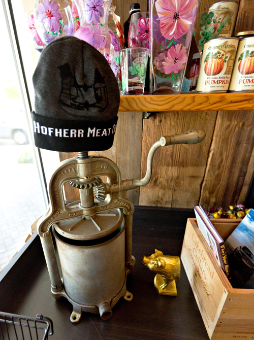 Stocking cap on a old-fashioned meat grinder
